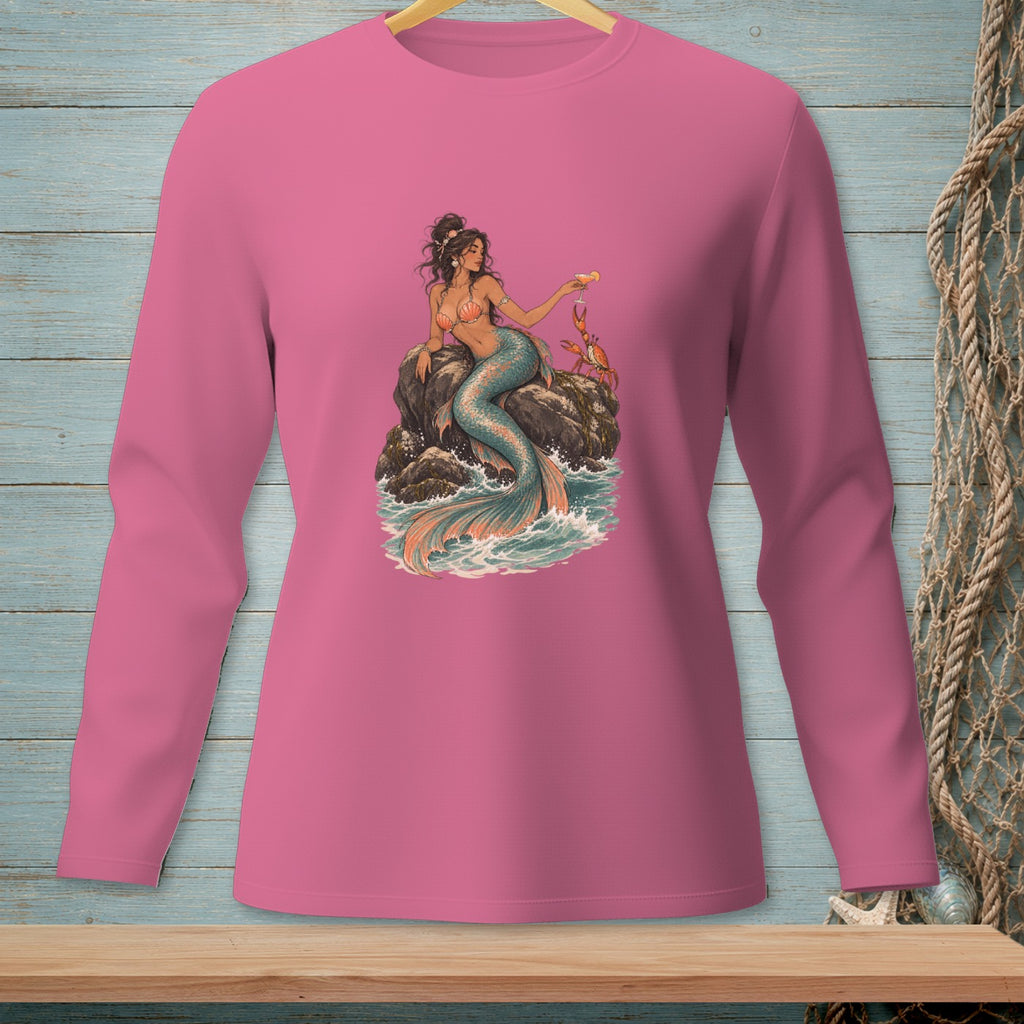 Pink long-sleeved shirt featuring a mermaid holding a drink with a crab on rocks.