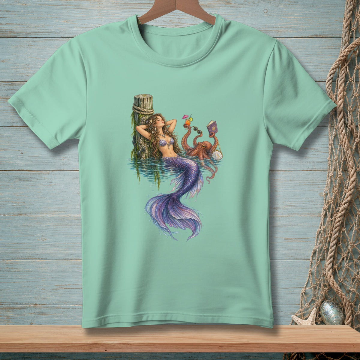 Mermaid relaxing with an octopus reading a book and drinks by a post.