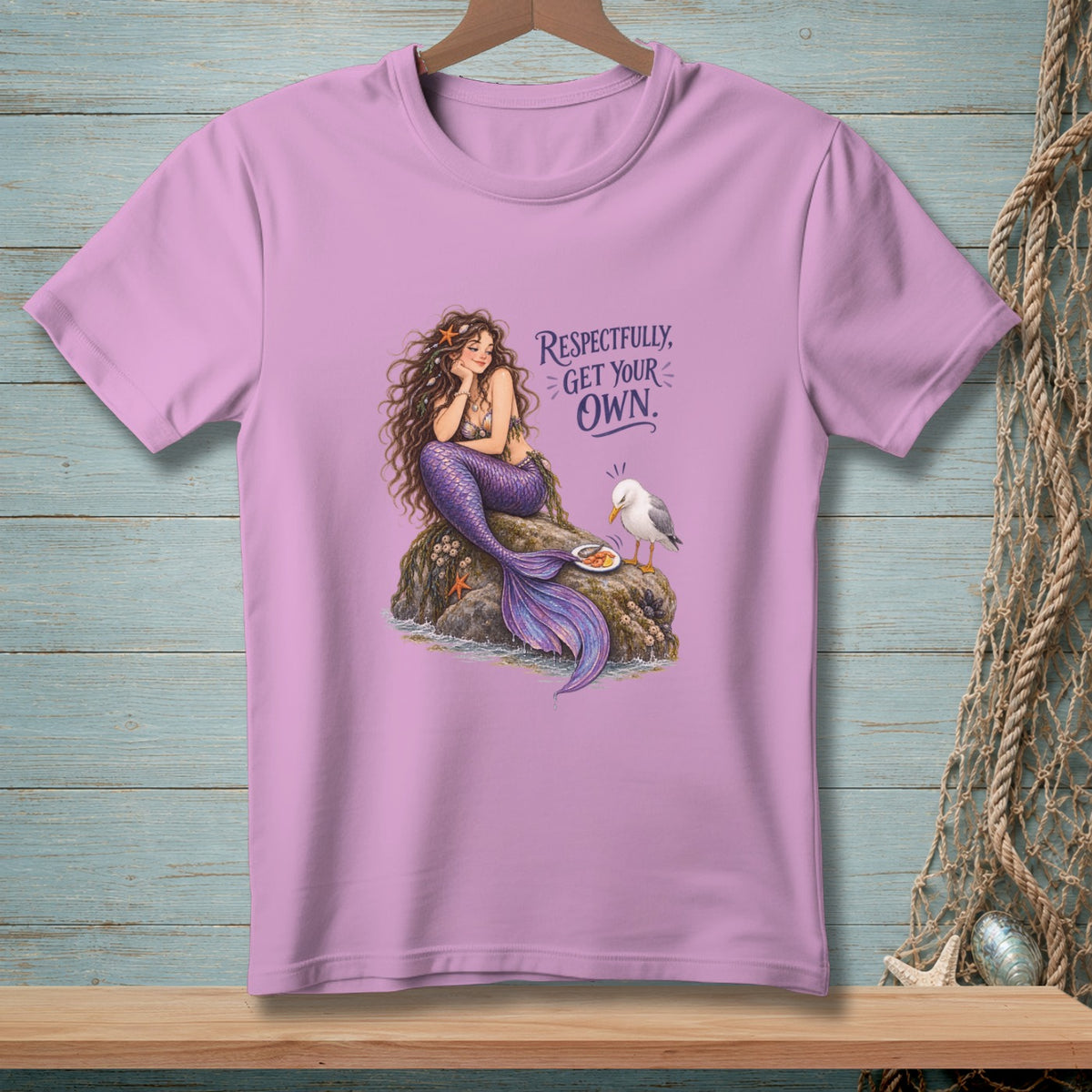 Pink t-shirt with illustration of a mermaid, a seagull, and the text "Respectfully, Get Your Own."