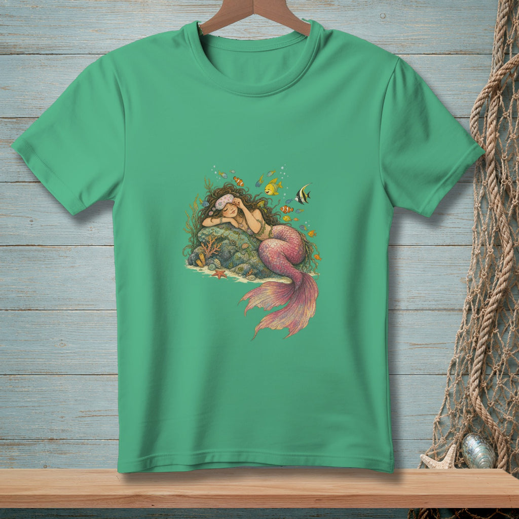 Green t-shirt featuring a sleeping mermaid on a rock surrounded by coral and fish.