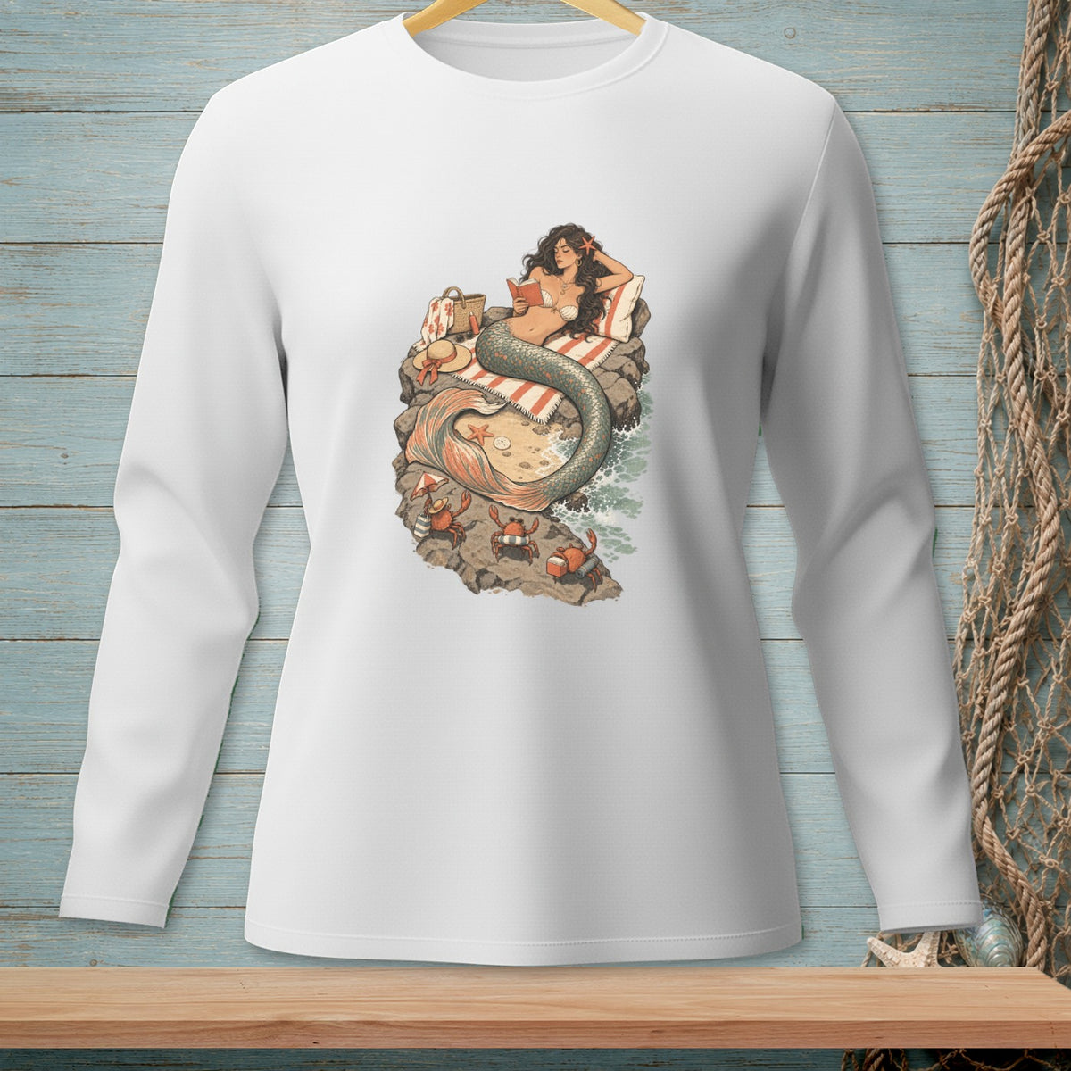 Illustration of a mermaid reading a book on a rock with crabs and a starfish.