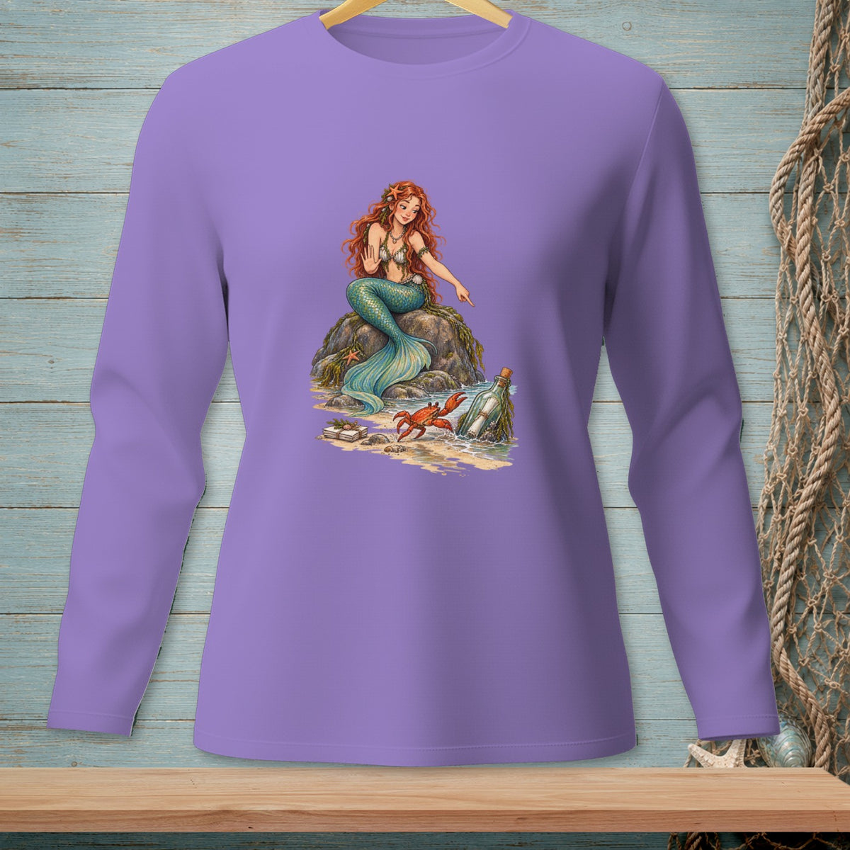 Purple long-sleeve shirt with a detailed illustration of a mermaid, crab, and message in a bottle.