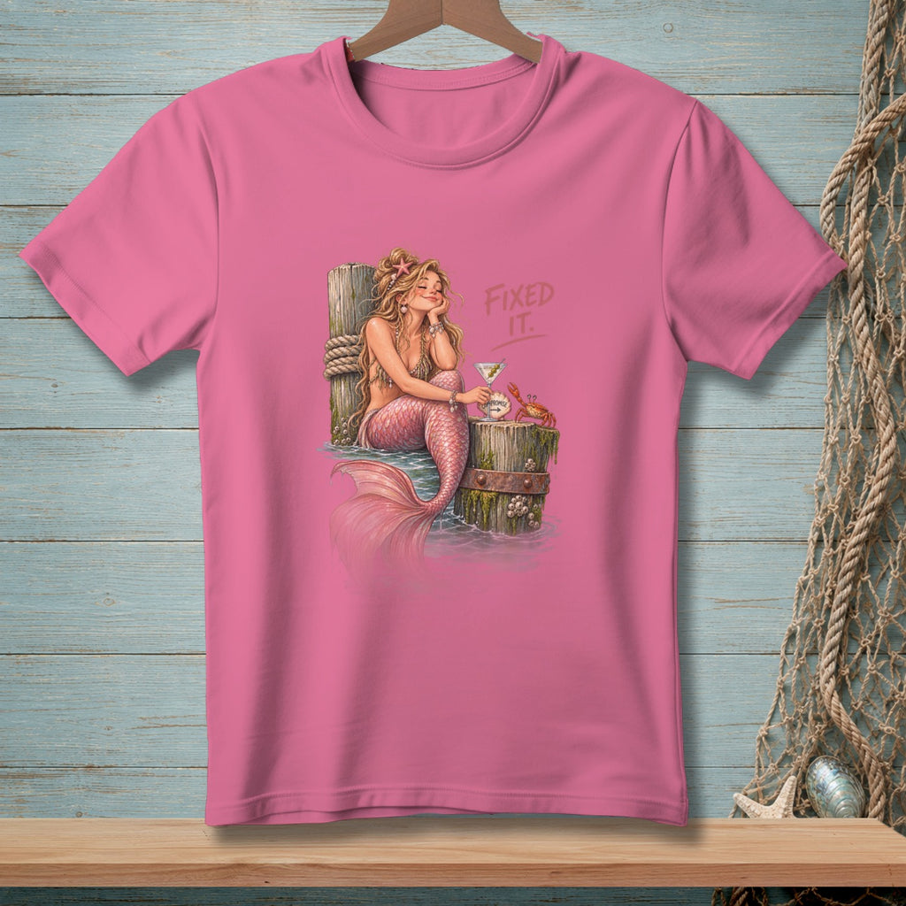Pink t-shirt with mermaid, crab, cocktail, and "Fixed It." text.