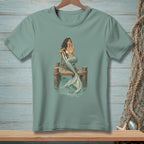 Mermaid sitting on a dock with a drink and a beach chair.