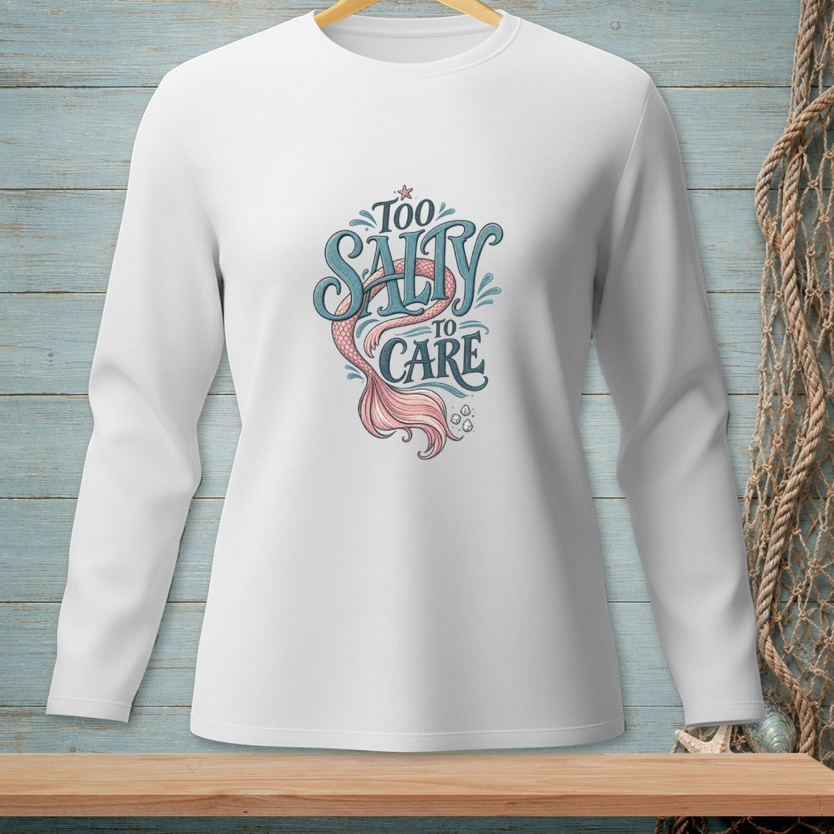 White long-sleeve shirt with "Too Salty to Care" and mermaid tail design.