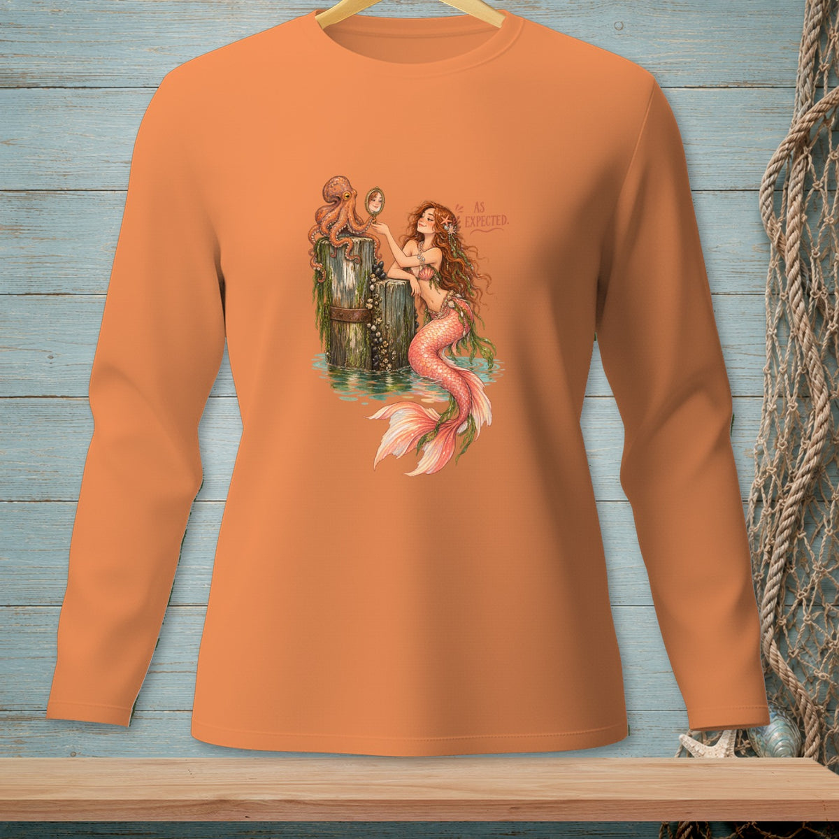 Mermaid with pink tail and octopus on dock looking in mirror. "AS EXPECTED."