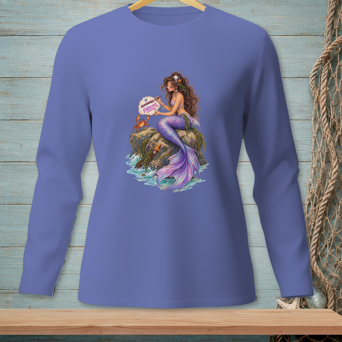 Mermaid on a rock holding a sign that says "Be Fabulous"