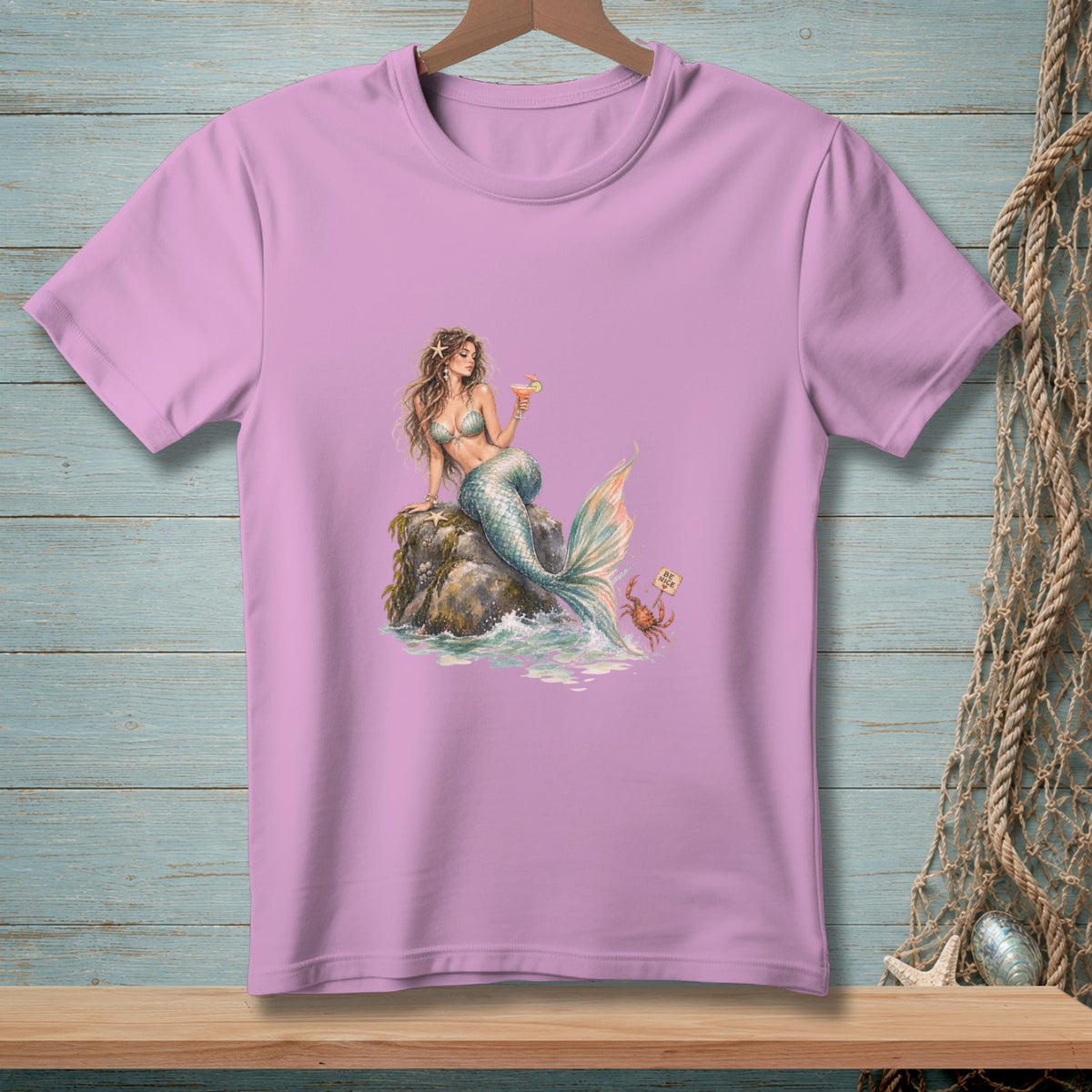 Lavender t-shirt with a mermaid holding a drink and a crab holding a sign.