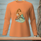 Orange long-sleeve shirt with a mermaid holding a drink and a sign that says "Attitude".