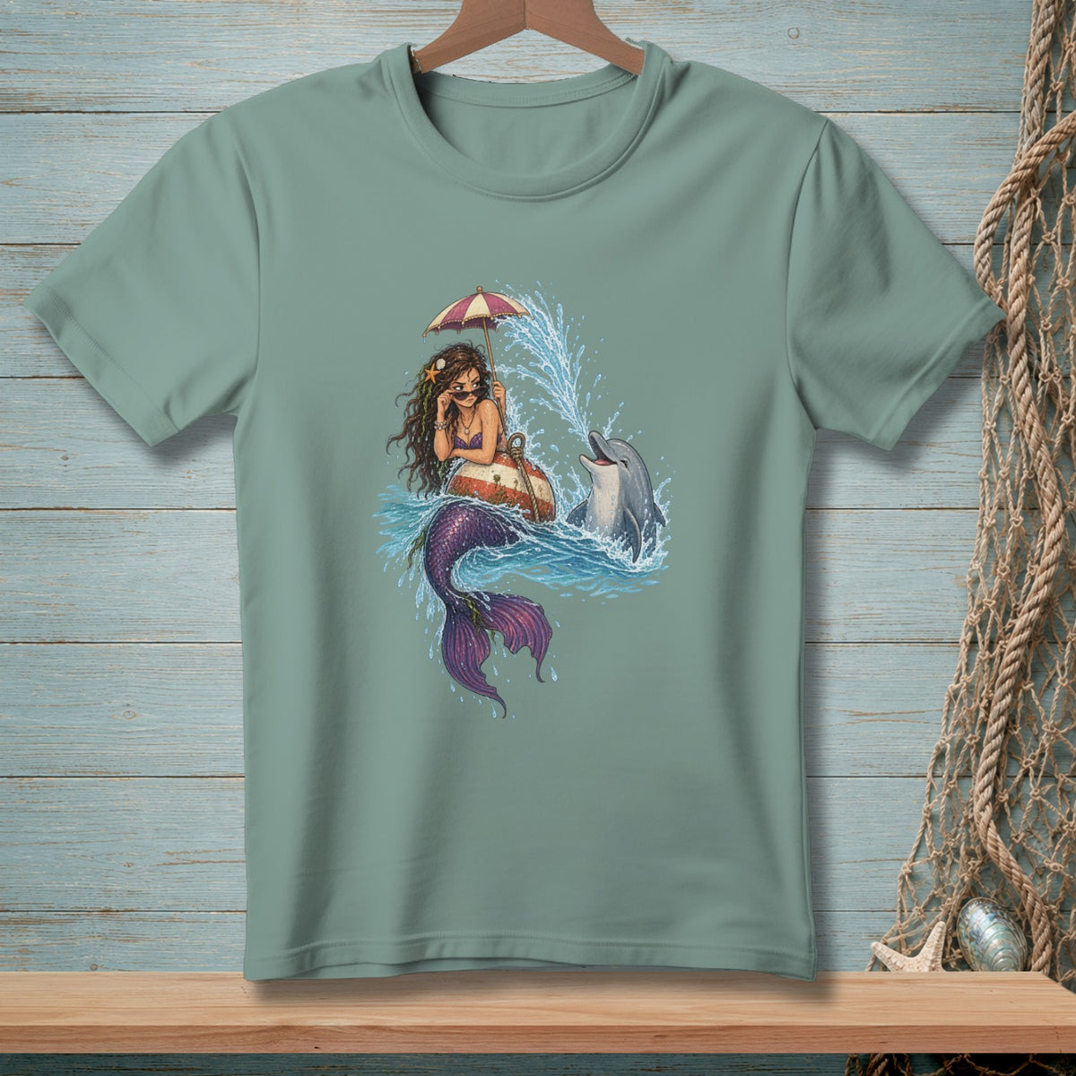 Mermaid on a float with a dolphin in splashing water under an umbrella.