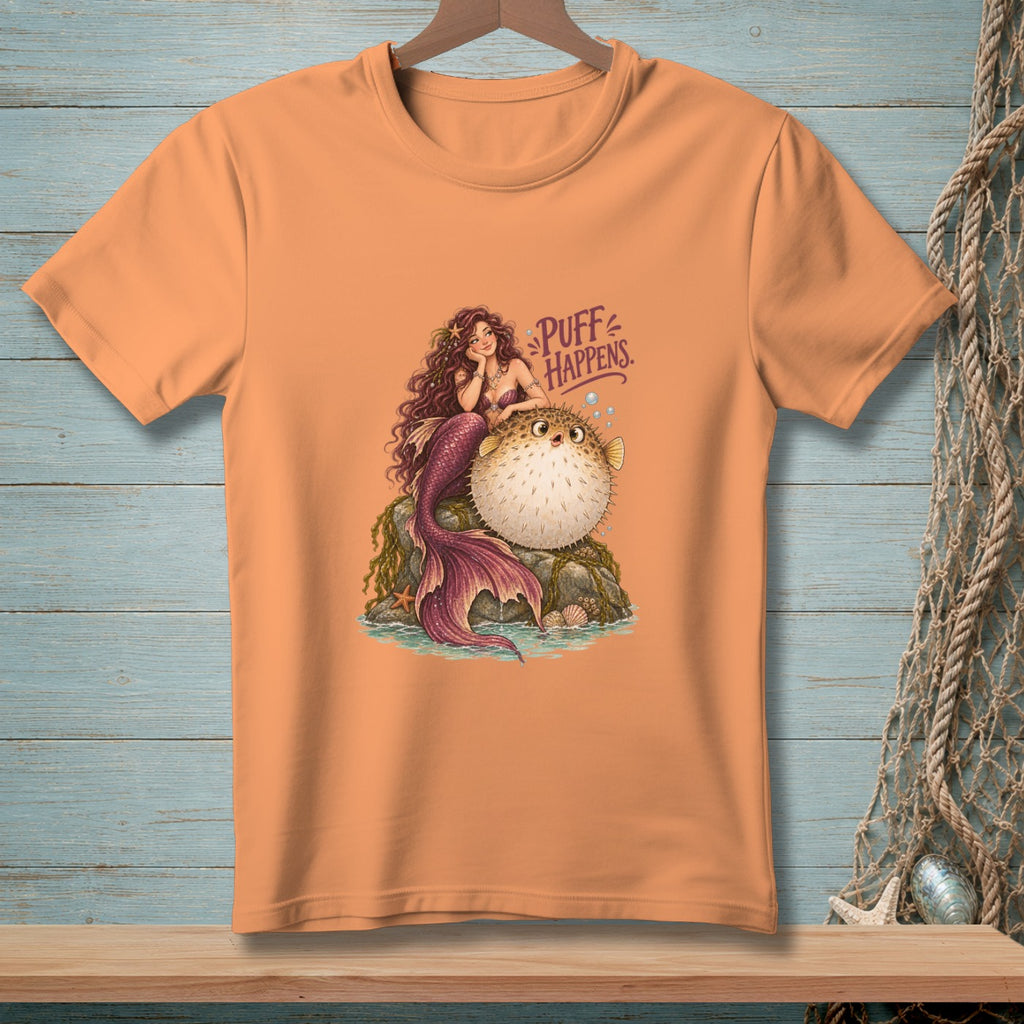 Mermaid resting on a rock with a pufferfish and text "Puff Happens."