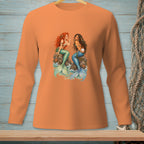 Two mermaids, one with red hair, one with dark hair, sitting on rocks.
