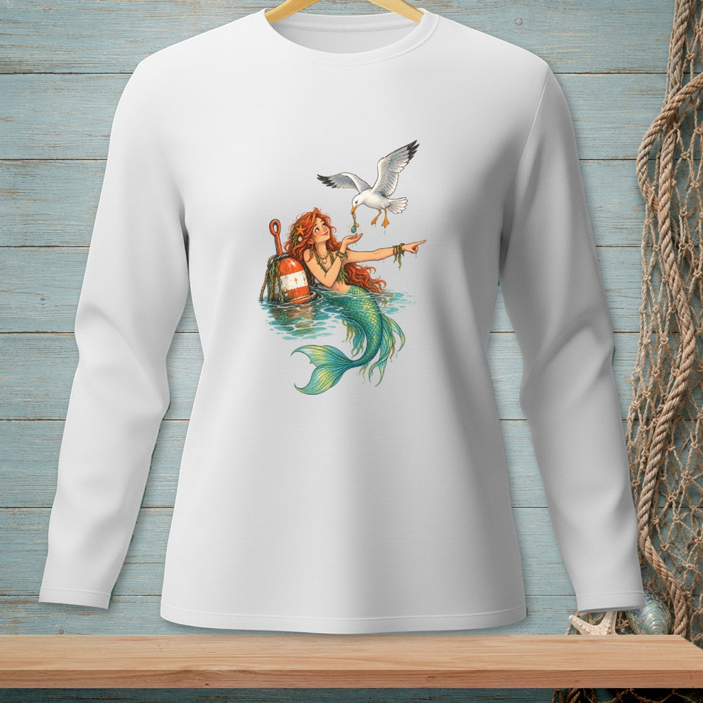 Mermaid with red hair, green tail, and a seagull by a buoy on a white long-sleeved shirt.