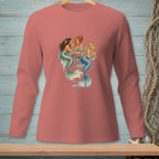 Three mermaids with colorful tails sit around a tray of drinks on a salmon long-sleeved shirt.
