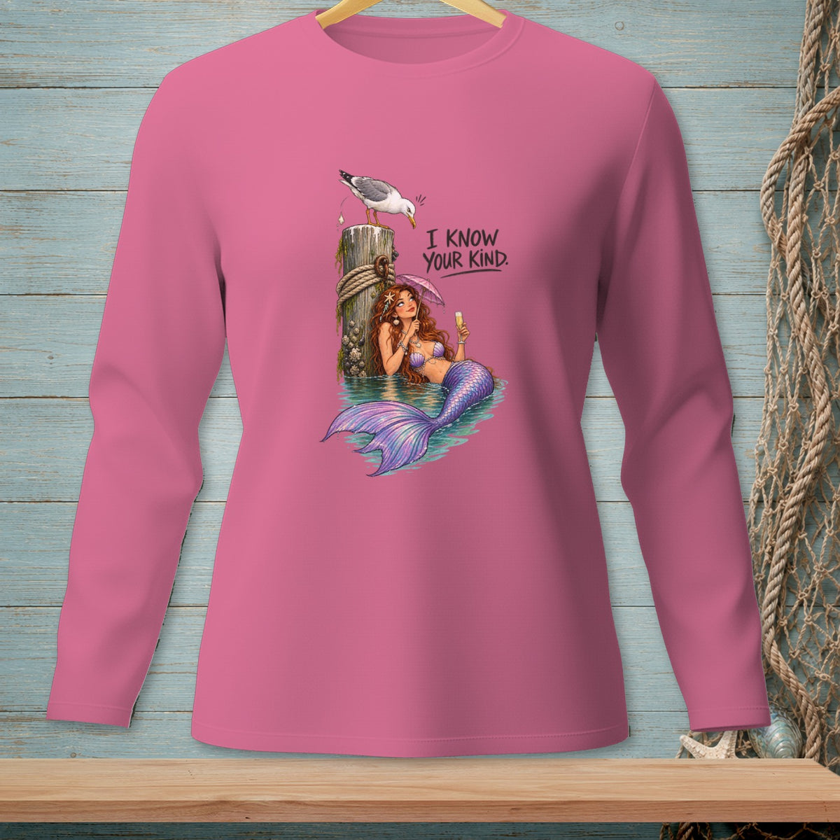 Pink long sleeve shirt with mermaid and seagull graphic and "I KNOW YOUR KIND." text.
