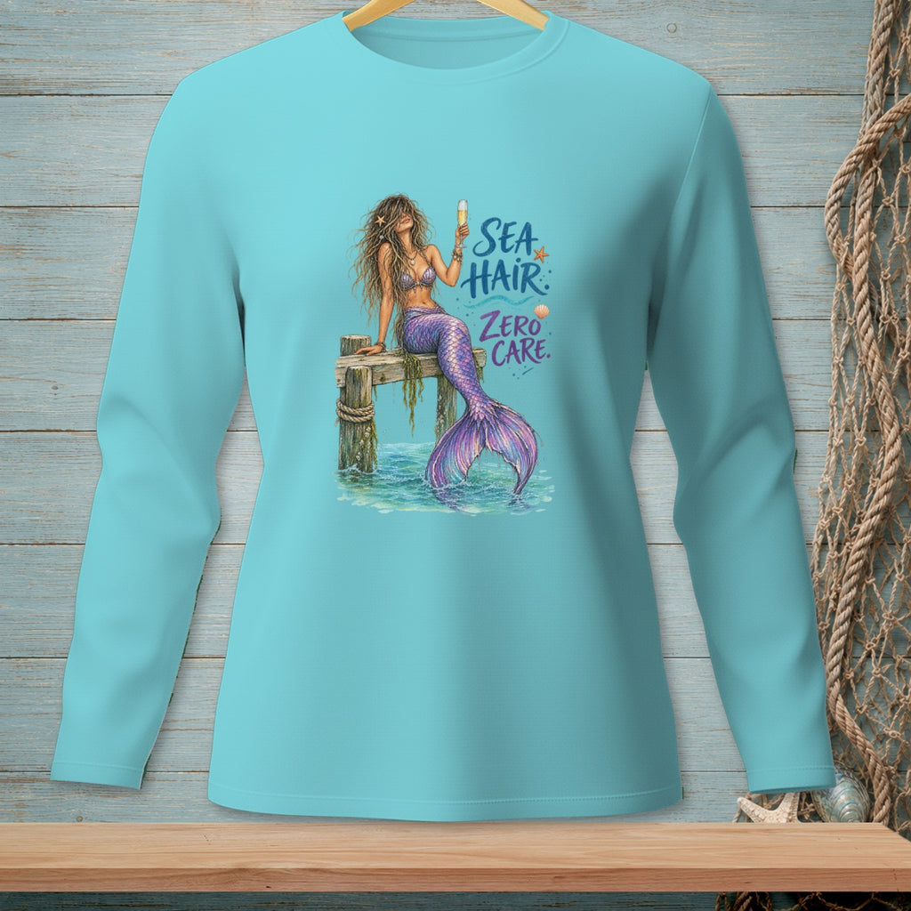 Mermaid holding champagne on dock with text "Sea Hair, Zero Care"