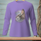 Mermaid sitting on rock by the sea, printed on a lavender long-sleeve shirt.