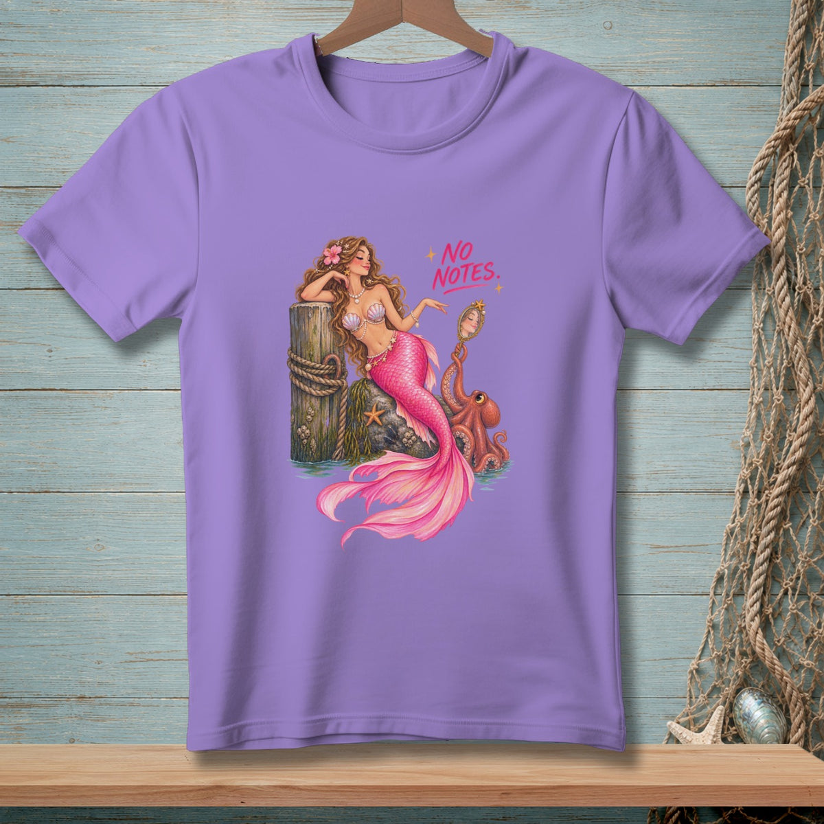 Lavender t-shirt with mermaid, octopus, mirror, and "No Notes" text.
