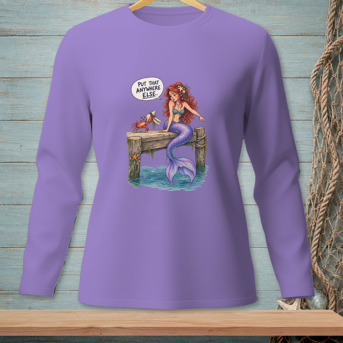 Purple long-sleeve shirt with mermaid and crab on a dock saying "Put that anywhere else."