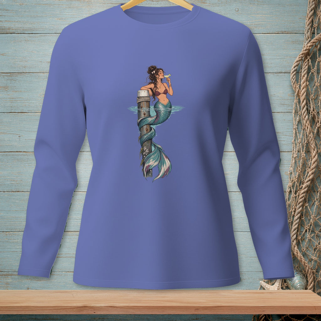 Illustration of a mermaid with a cocktail, sitting on a wooden post in the water.