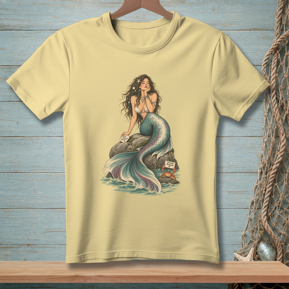 T-shirt with mermaid illustration and humorous signs, "Your problem" and "Attitude problem."