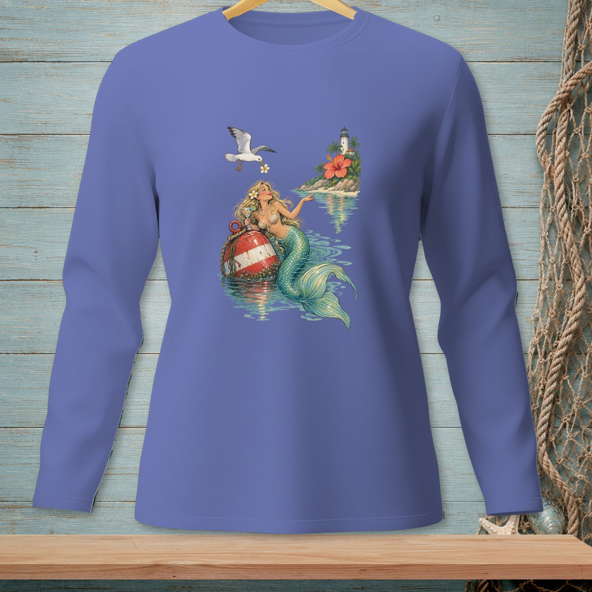 Long-sleeve shirt with a mermaid sitting on a buoy with a seagull and lighthouse design.