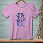 Purple t-shirt with "Don't Test The Waters" text and mermaid tail graphic.