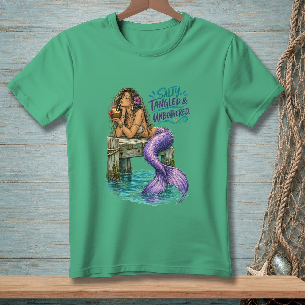 Mermaid with purple tail drinking from a coconut on a dock, with text "Salty, Tangled & Unbothered."