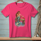 Mermaid sitting on a dock reading a letter with a crab and cocktail.