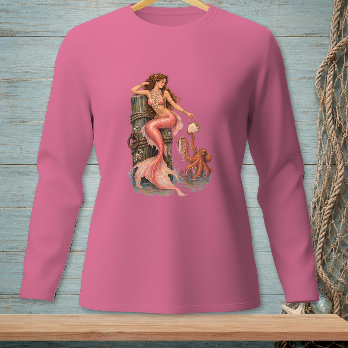 Pink long-sleeve shirt with a mermaid and octopus graphic.