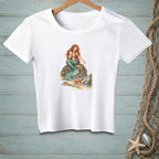 White t-shirt with illustration of a mermaid, crab, and bottle on a rock.