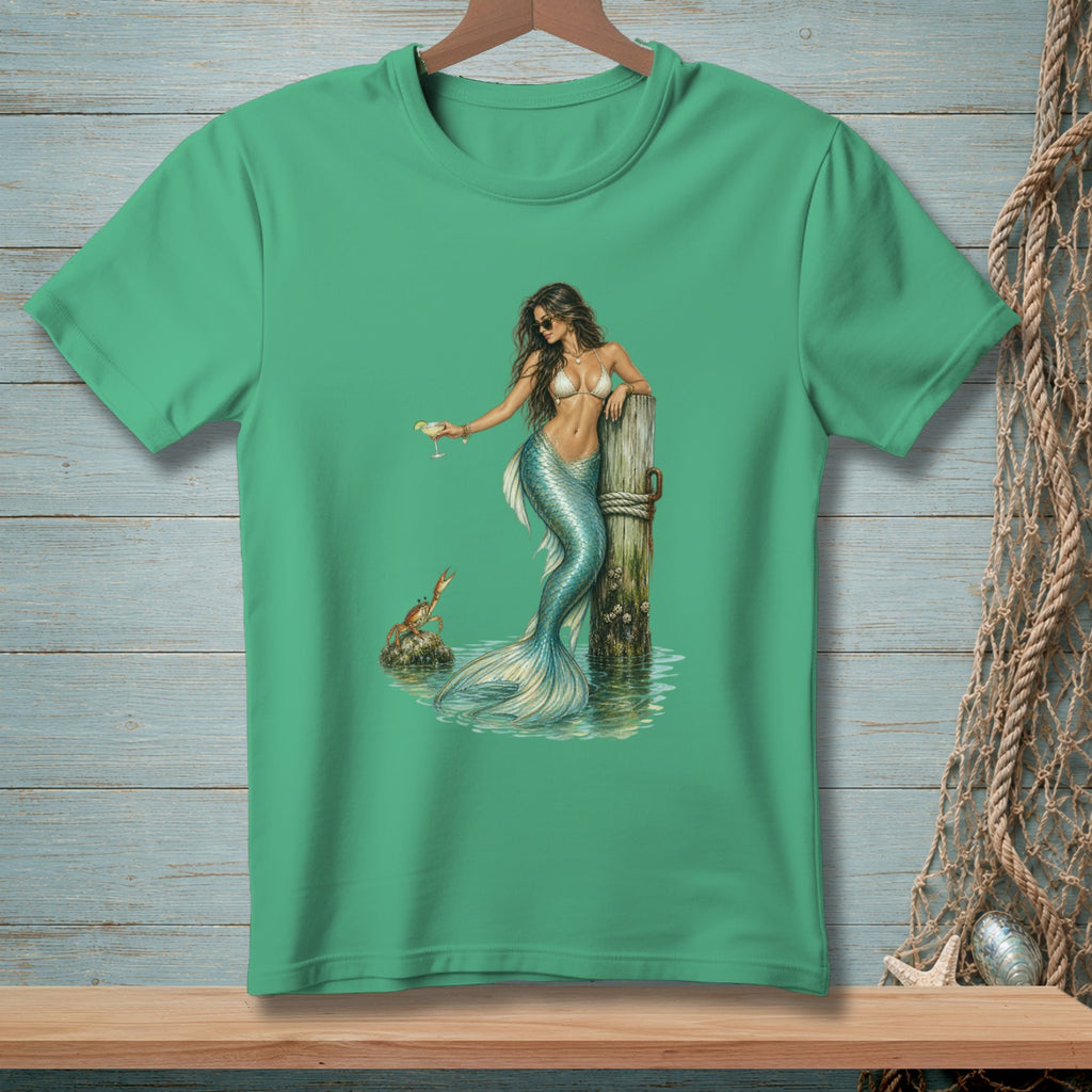 Mermaid with a cocktail and a crab on a wooden post in the water.