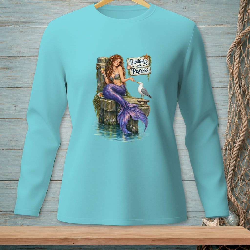 Mermaid with a glass of wine sits on a pier next to a seagull, with text "Thoughts and Prayers."