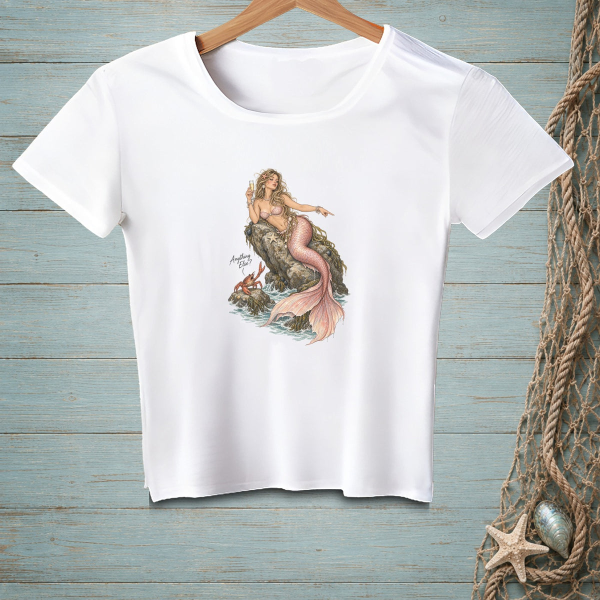 White t-shirt with illustration of mermaid, crab, and text "Anything Else?"