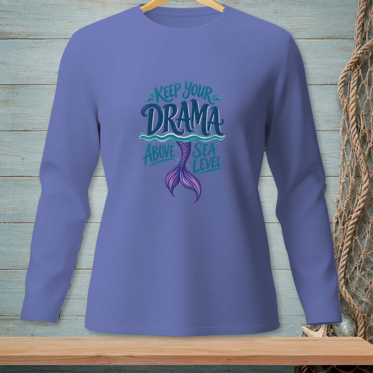 Long-sleeved shirt with mermaid tail graphic and "Keep Your Drama Above Sea Level" text.
