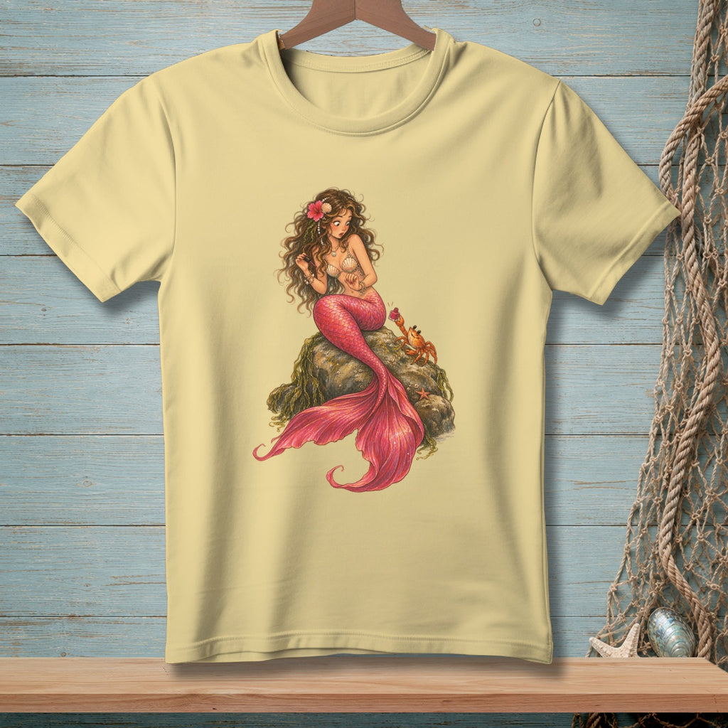 Light yellow t-shirt with a detailed illustration of a mermaid and a crab on a rock.