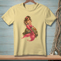 Light yellow t-shirt with a detailed illustration of a mermaid and a crab on a rock.