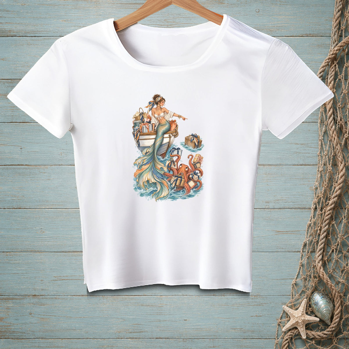 White t-shirt with mermaid pointing at octopi and gifts in the ocean.