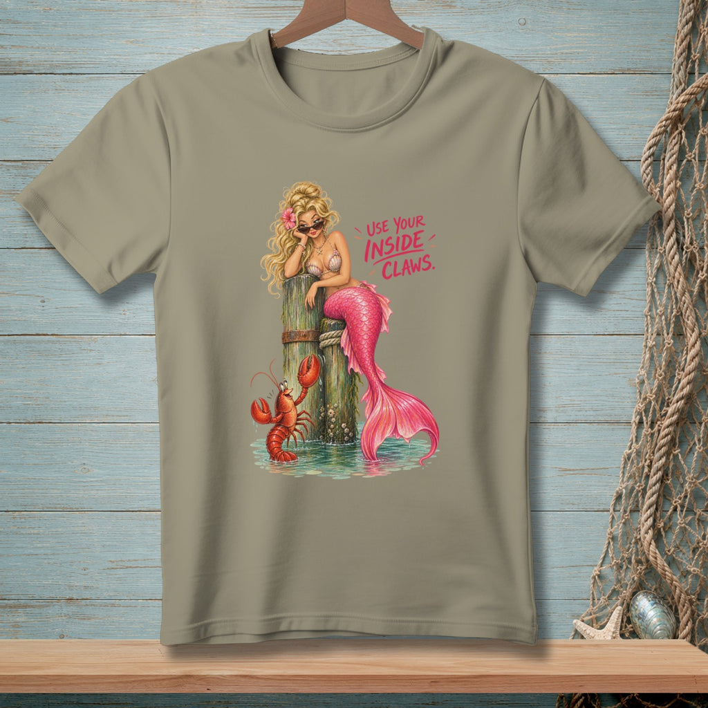 Mermaid with pink tail and lobster by wooden post, text "USE YOUR INSIDE CLAWS."