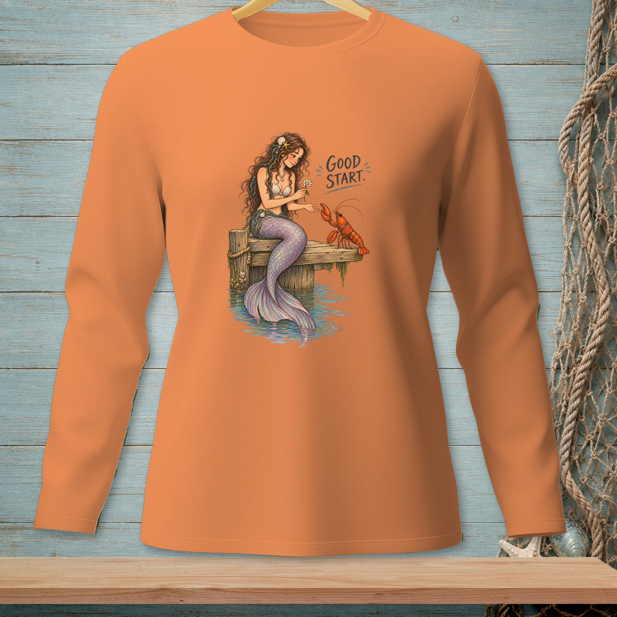 Mermaid sitting on a dock with a lobster, text says "GOOD START."