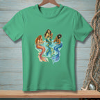 Three mermaids with colorful tails relax in blue water, one holding drinks.