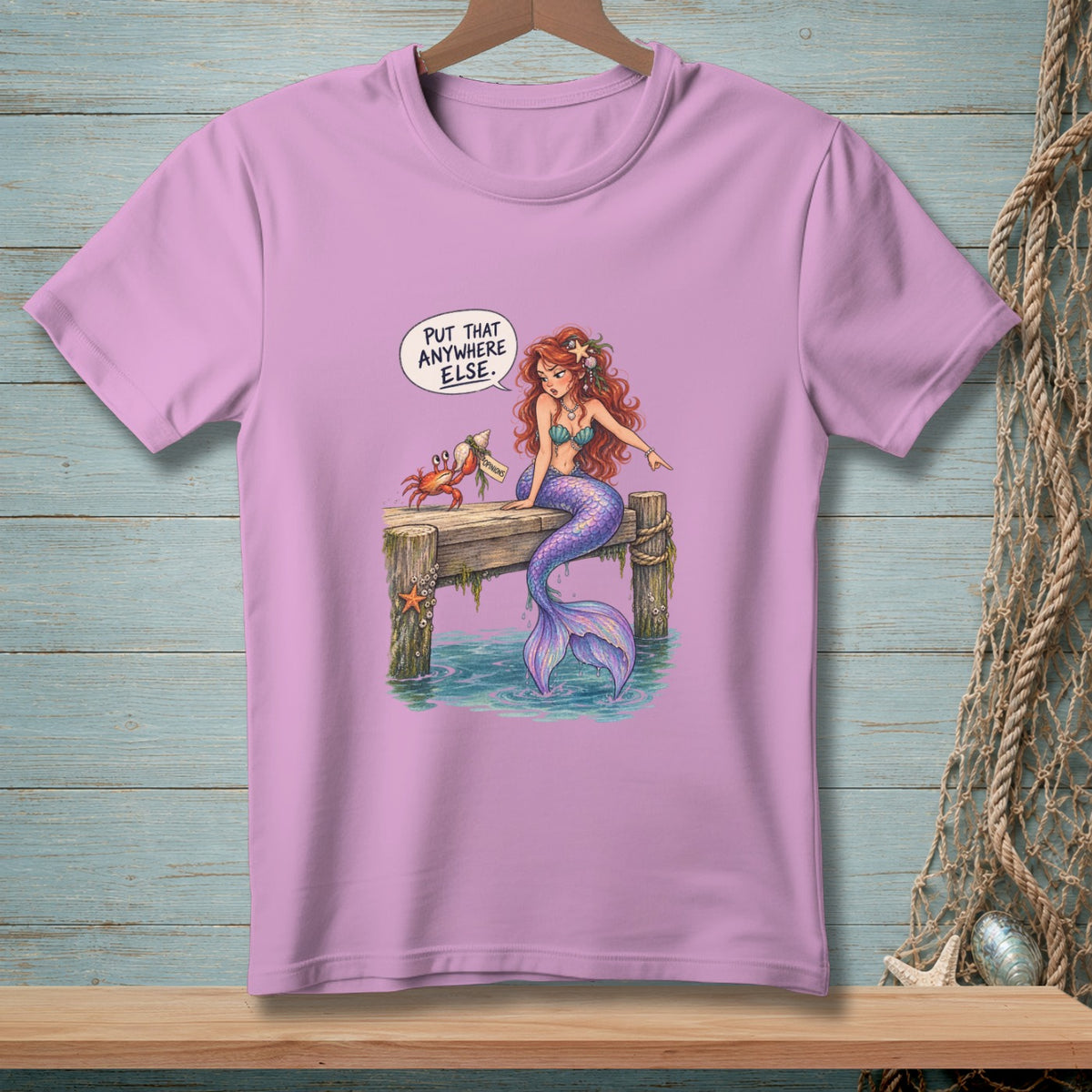 Mermaid and crab on pier with text "Put That Anywhere Else."