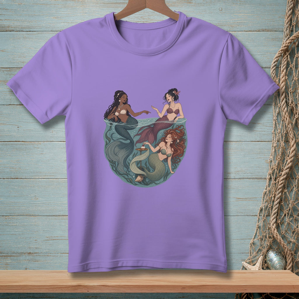Three mermaids in a circle design, with one holding a shell and cupcake.