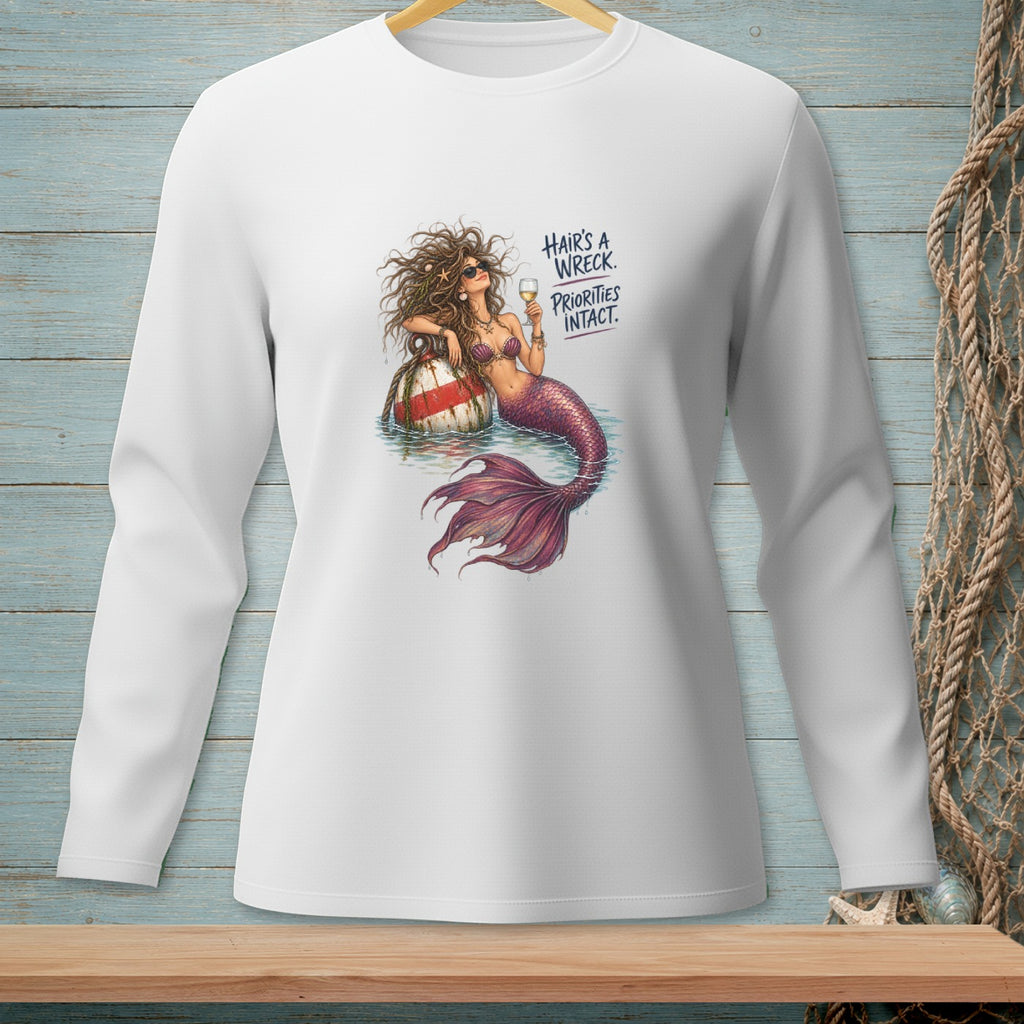 White long-sleeve shirt with mermaid graphic and text "Hair's a wreck. Priorities intact."