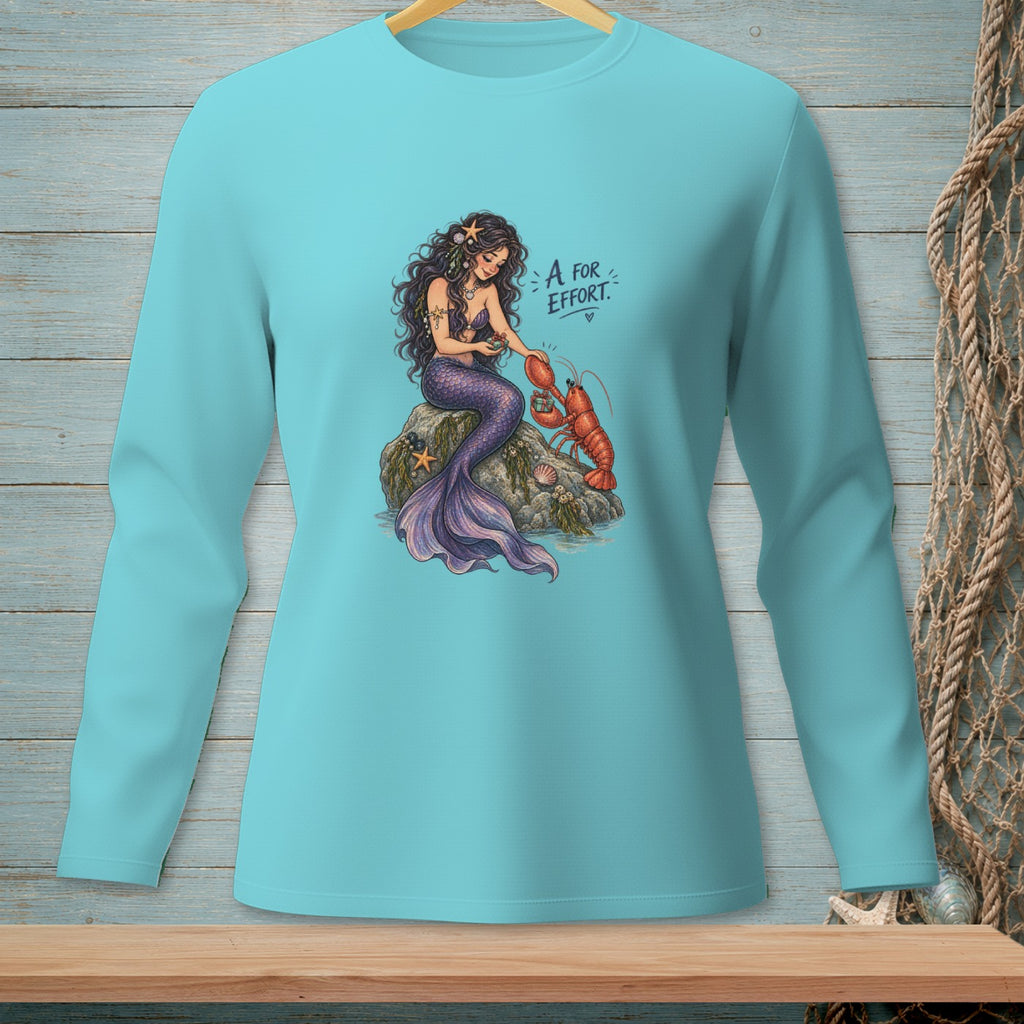 Mermaid with purple tail offers a lobster a gift, with text "A for Effort".