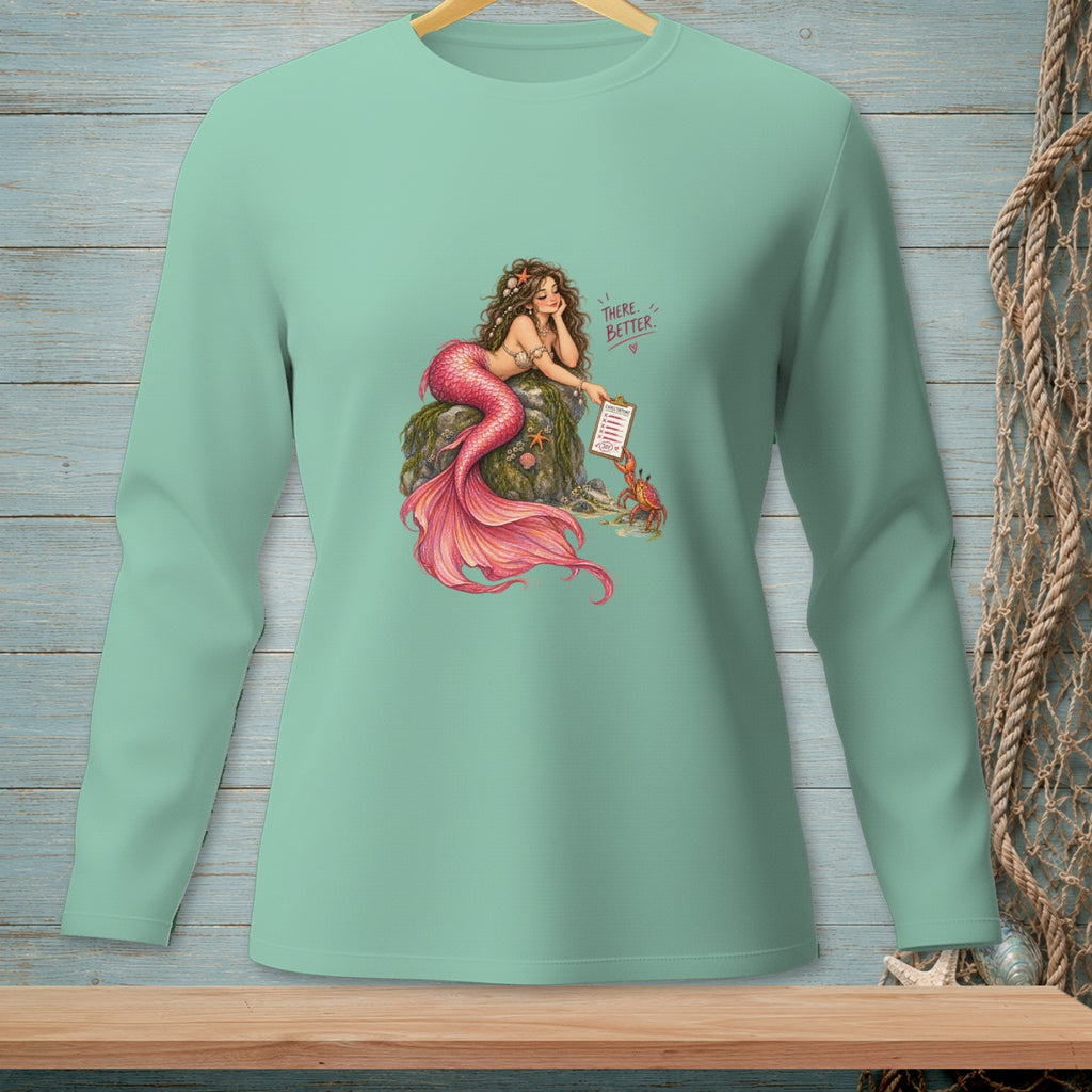 Mermaid with pink tail resting on rock, holding checklist, text "There. Better."