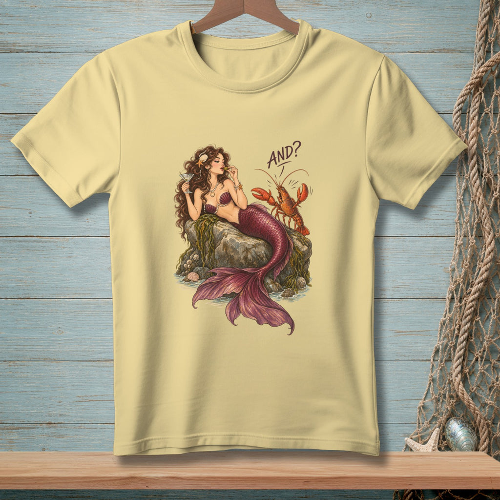 Light yellow t-shirt with a mermaid and lobster graphic that says "AND?".