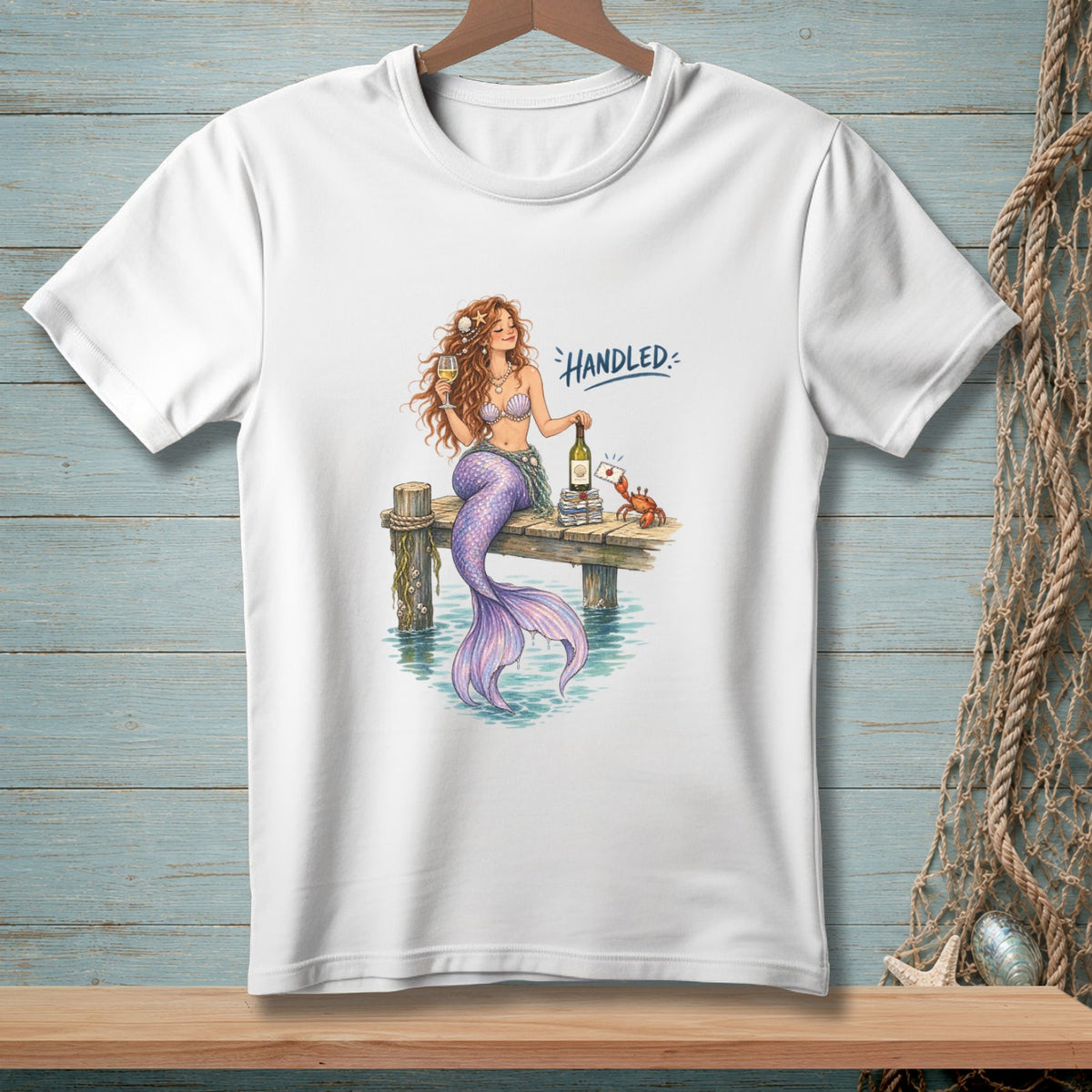 Mermaid with wine and crab on pier, with text "Handled."
