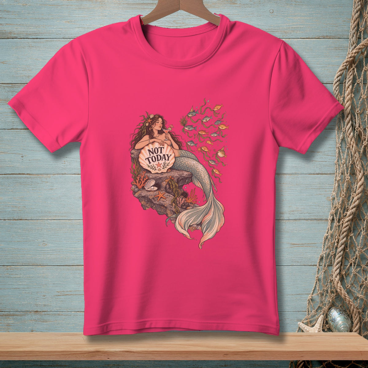 Pink t-shirt with a mermaid graphic holding a shell that says "NOT TODAY."