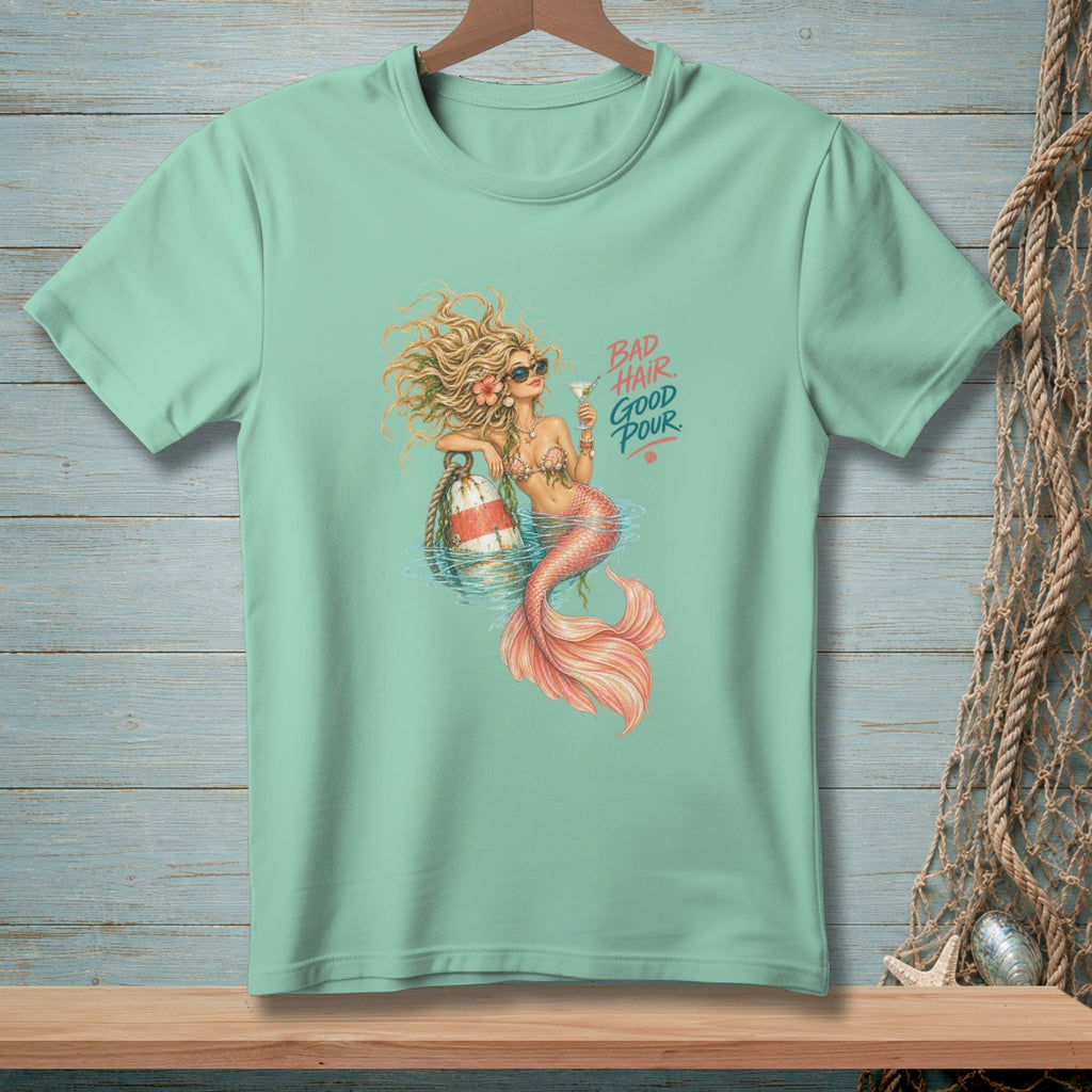 Mint green t-shirt with mermaid graphic and text "BAD HAIR GOOD POUR."